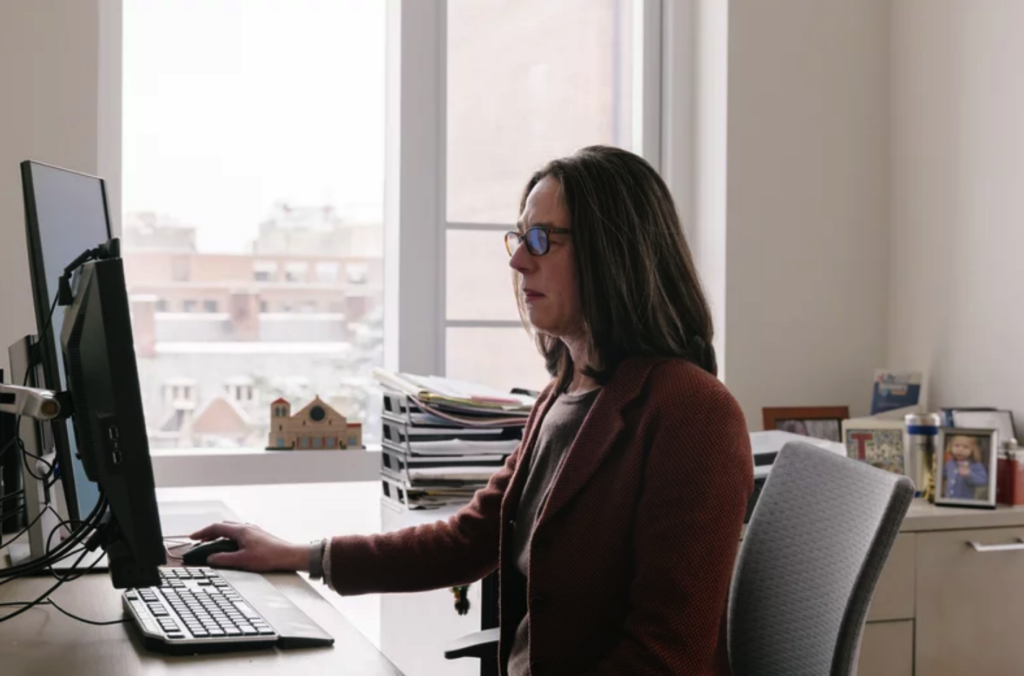 Sara Jaffee working at her desk