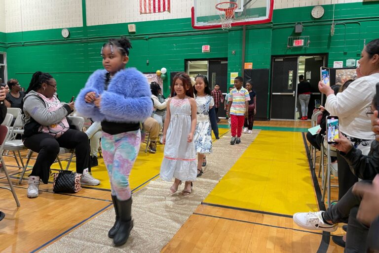 Children processing into the gym.