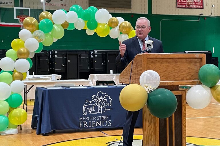 Bernie Flynn speaking at a podium
