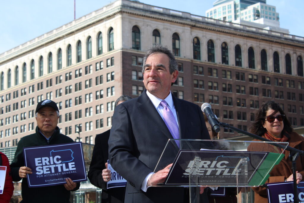 Eric Settle speaking at a podium