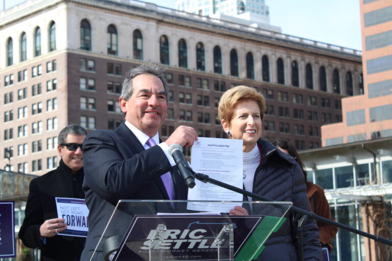 Eric Settle posing with Christine Todd Whitman