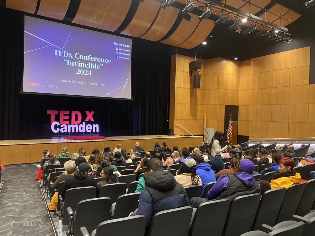 An audience in front of a stage