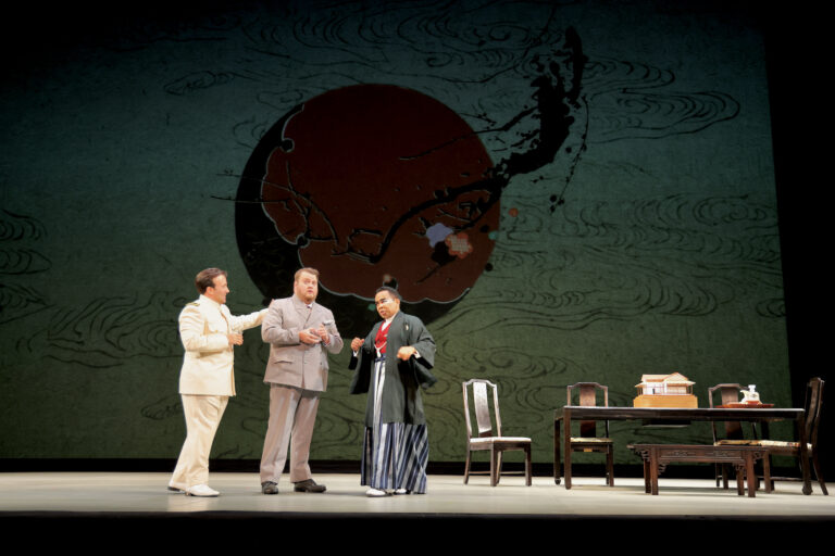 Lt. Pintkerton (Anthony Ciaramitaro), Sharpless (Anthony Clark Evans), and Goro (Martin Bakari) rehearse a scene from Opera Philadelphia's production of ''Madame Butterfly.''