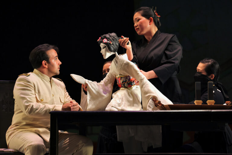 Karen Chia-ling Ho manipulates the puppet that represents Madame Butterfly with the help of two puppeteers.