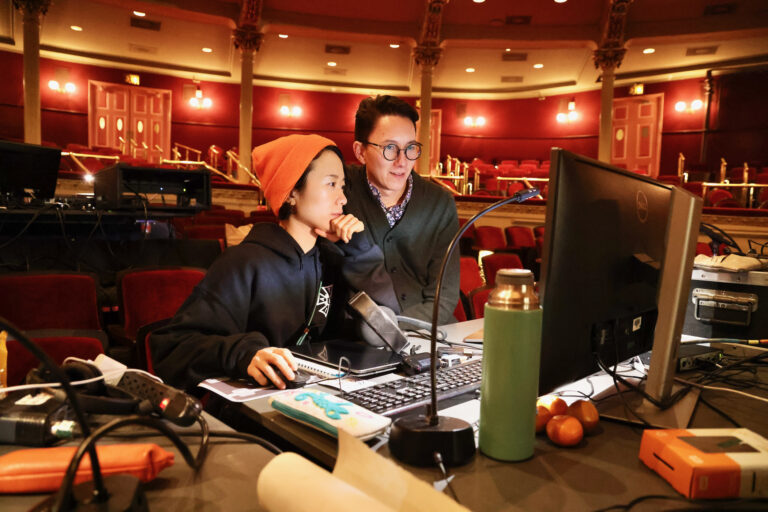 Production designer Yuki Izumihara (left) and director Ethan Heard prepare for a dress rehearsal of Madame Butterfly with Opera Philadelphia at the Academy of Music.