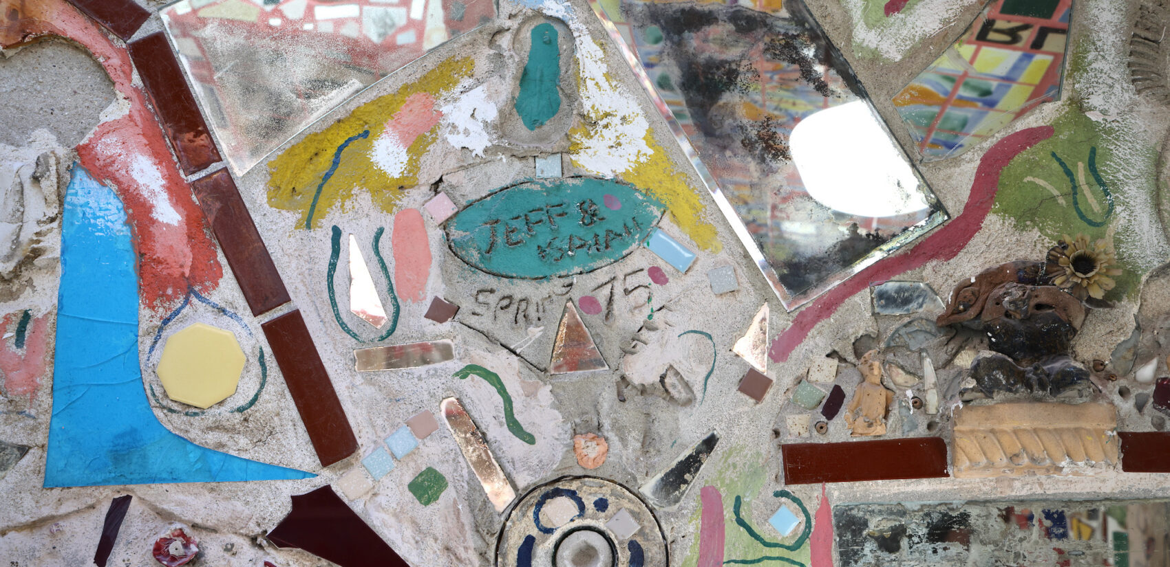 An uncovered Isaiah Zagar mural