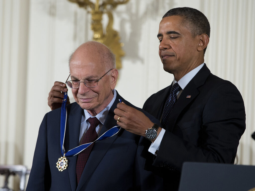 Daniel Kahneman FILE - President Barack Obama awards psychologist Daniel Kahneman with the Presidential Medal of Freedom, Nov. 20, 2013, during a ceremony in the East Room of the White House in Washington. Kahneman, a psychologist who won a Nobel Prize in economics for his insights into how ingrained neurological biases influence decision making, died Wednesday, March 27, 2024, at the age of 90. (AP Photo/Evan Vucci, File)