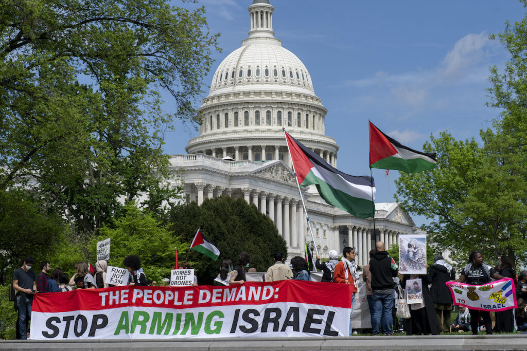 Pro-Palestinian activists demonstrate outside the Capitol