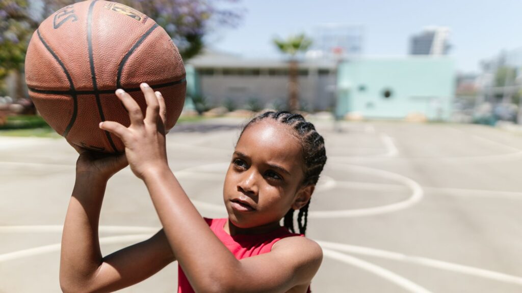 Young kid shooting a basketball Philly is a big sports city with the Sixers, Eagles, Flyers, Union and Phillies. But, the city currently does not have a WNBA team. Why?