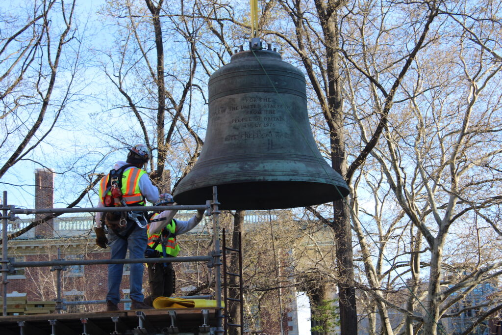 bell-e-neil-2024-04-06-14 An engineering team placed the Bicentennial Bell, which had been in storage since 2013, in its new home in the Bicentennial Bell Garden on 3rd and Walnut streets on April 6, 2024. (Emily Neil/WHYY)