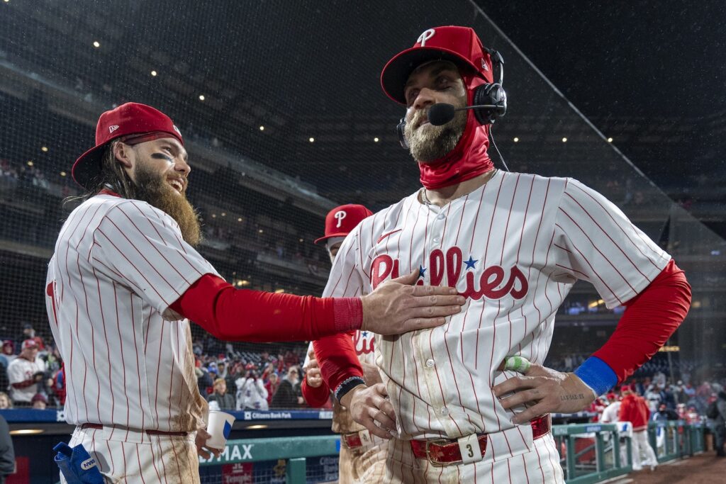 Reds Phillies Baseball Philadelphia Phillies' Bryce Harper, right, gets interviewed as Brandon Marsh, left, and Bryson Stott, center, celebrate with him following the baseball game against the Cincinnati Reds, Tuesday, April 2, 2024, in Philadelphia.