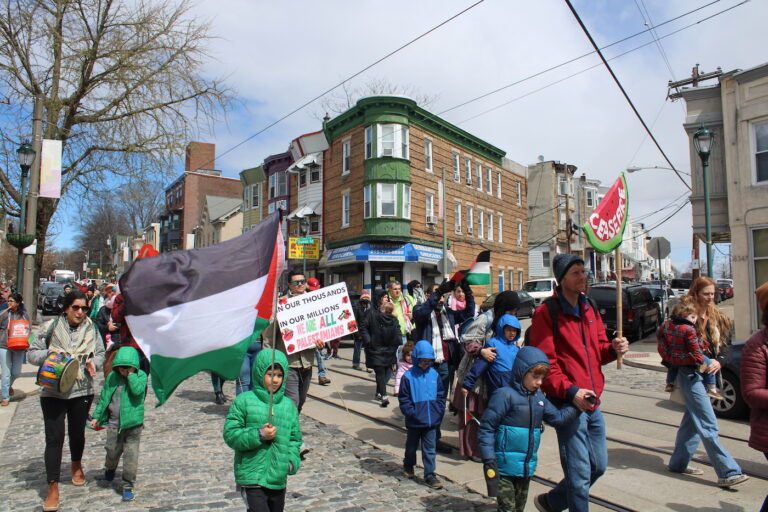 people marching in the street for a ceasefire