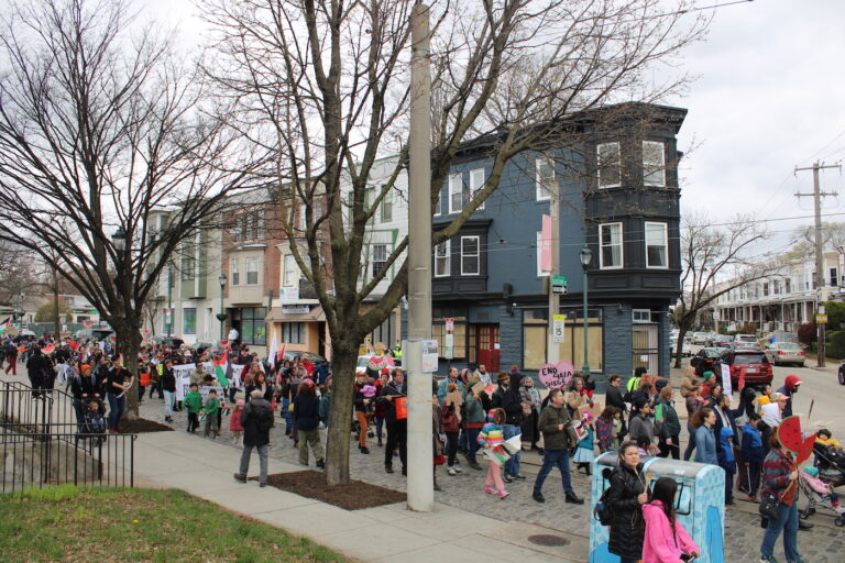 people marching in the street for a ceasefire
