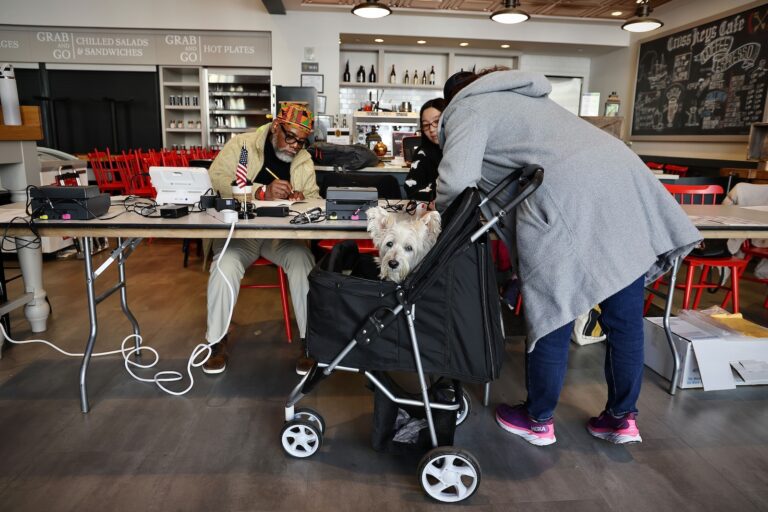 Melissa Lewis brought her dog, Poppy, to her polling place at the Museum of the American Revolution
