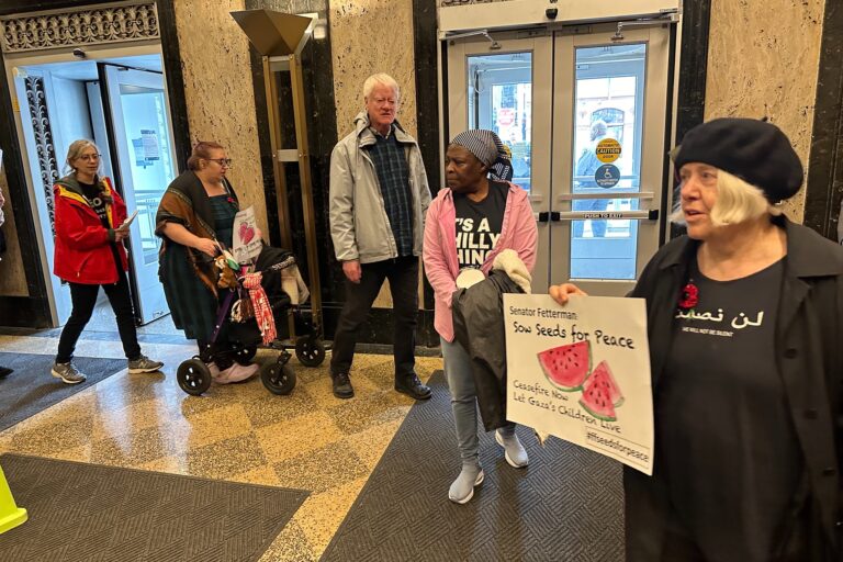 Peace activists protest in the lobby of the U.S. Custom House in Old City