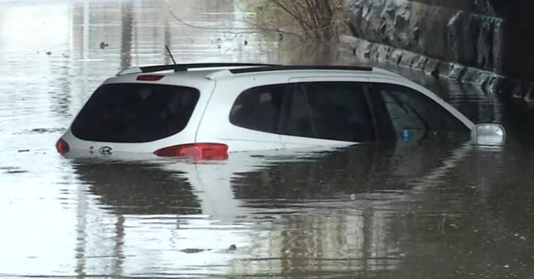 A vehicle is seen under water in Stanton, Delaware
