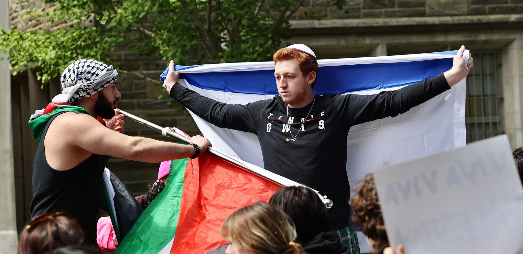 Qais Dana, a Community College of Philadelphia student from Palestine, and a Jewish student, who identified himself only as Danny, clash during a protest
