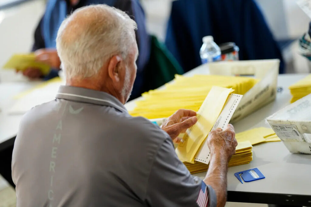 mail-ballot-pennsylvania A person puts a ballot in an envelope