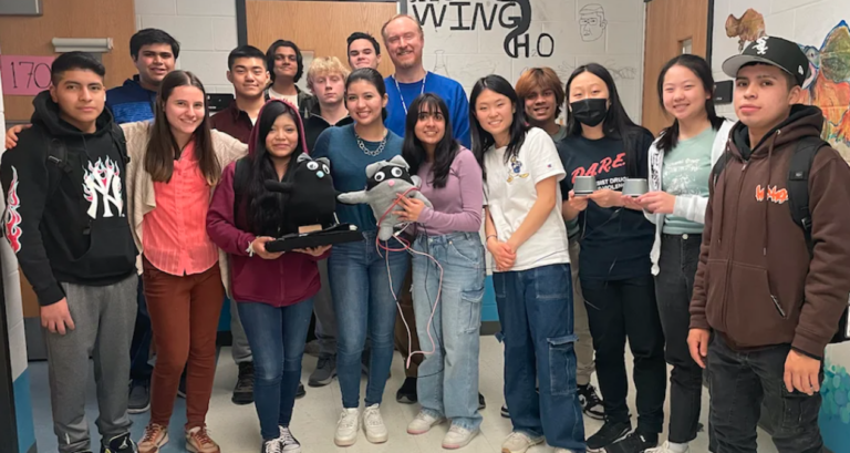 Some of the students representing Princeton High School in the Samsung Electronics Solve For Tomorrow STEM competition with their teacher, Mark Eastburn (center)