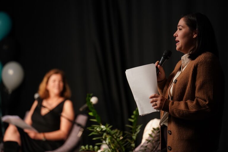 Melina Giakoumis reads a story as Maiken Scott listens on