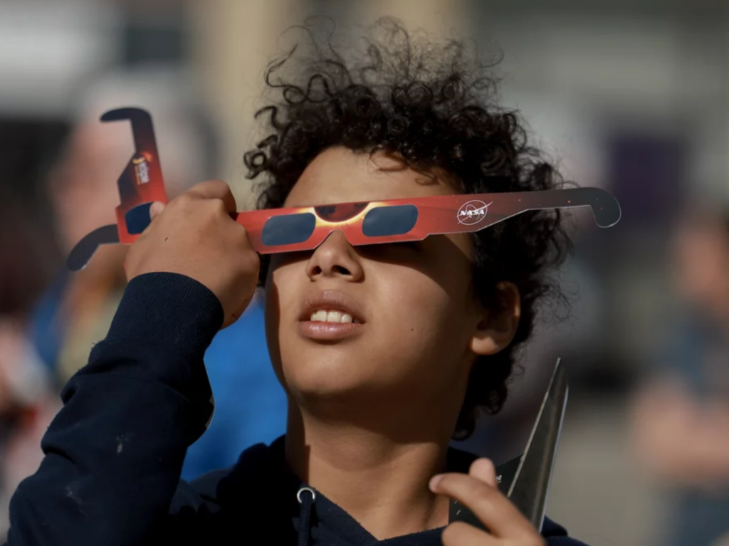 solar-eclipse-eye-damage-getty Junior Espejo looks through eclipse glasses