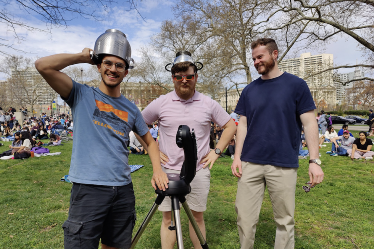 Eclipse-watchers gather on the Ben Franklin Parkway.