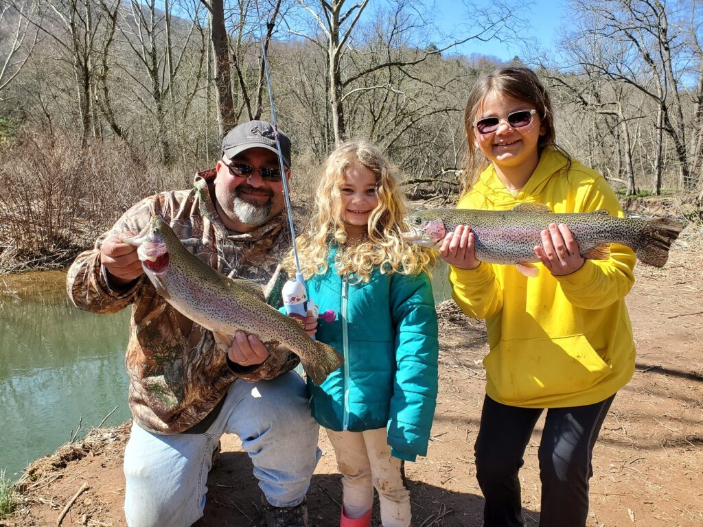 Fishers with caught trout