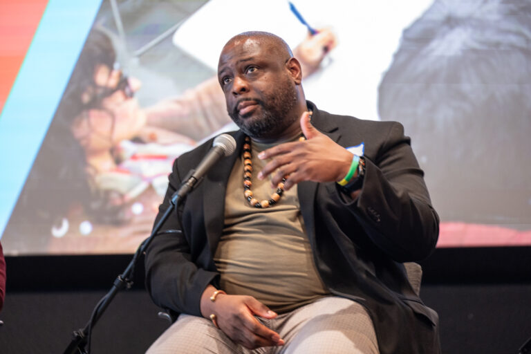 Lee Hill speaking on the panel