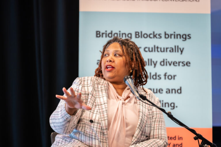 Jamila Bey speaking on stage