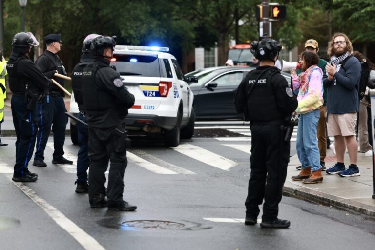 About a dozen protesters chant “free Palestine” at Philadelphia police blocking the entrance to Penn’s campus at 34th and Walnut streets after a student protest encampment was broken up, May 10, 2024.
