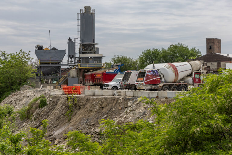 a look at a cliff on the edge of a cement company