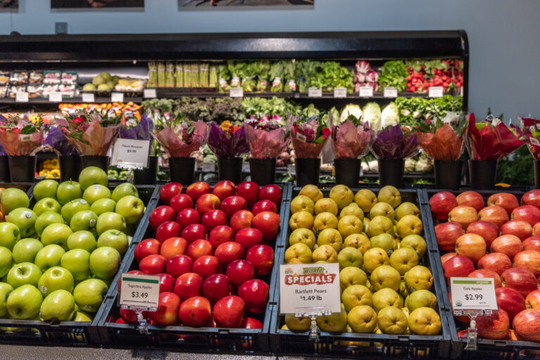 fresh apples, flowers and other produce