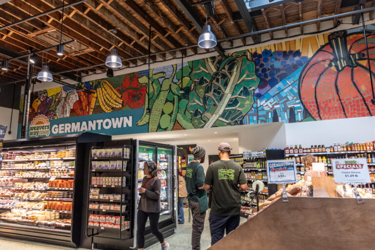 a mural in the store shows fruit and vegetables