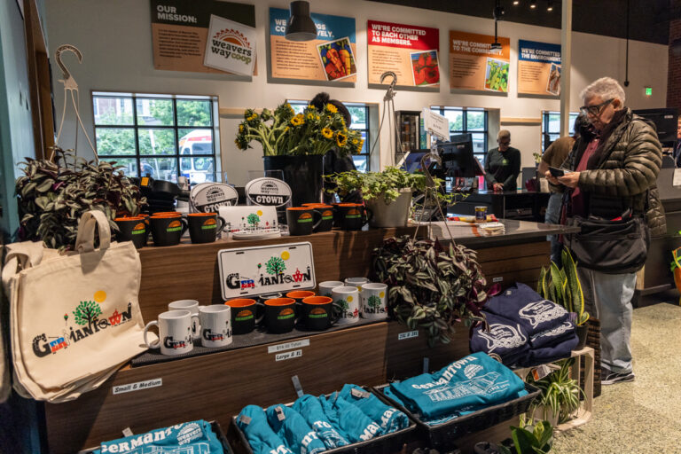 t-shirts, mugs and other merchandise in the store