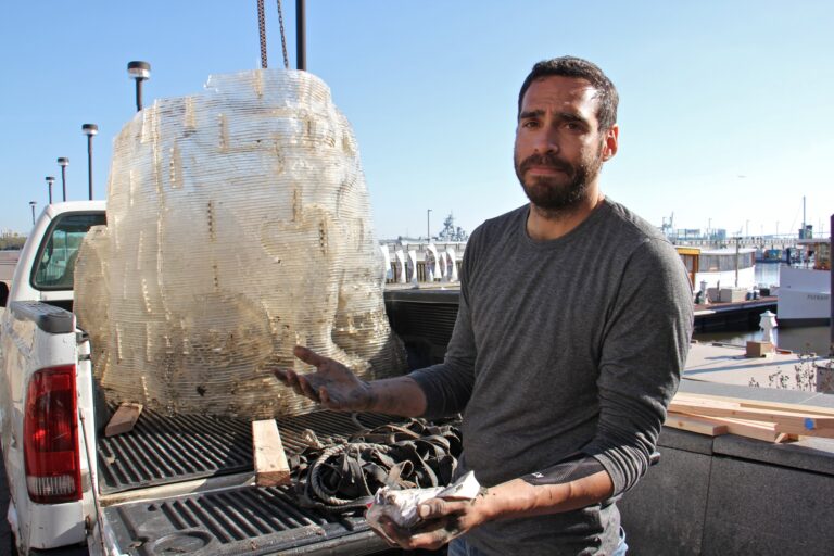 Miguel Horn and a recovered piece of his artwork
