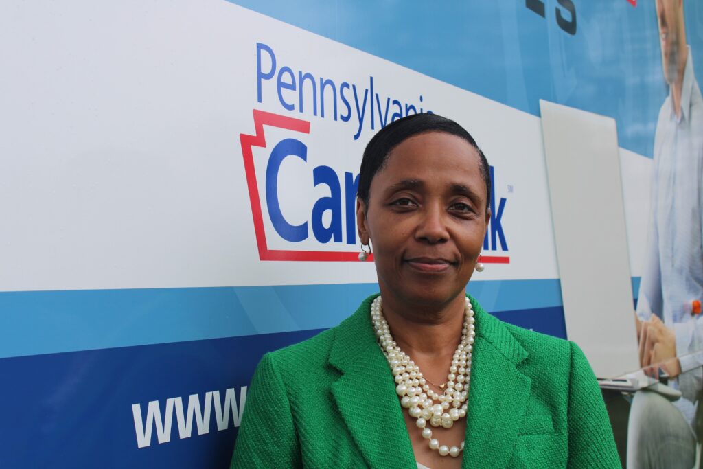2024-05-16-wow-bus-7 Billie Barnes next to the Bucks County Workforce on Wheels bus