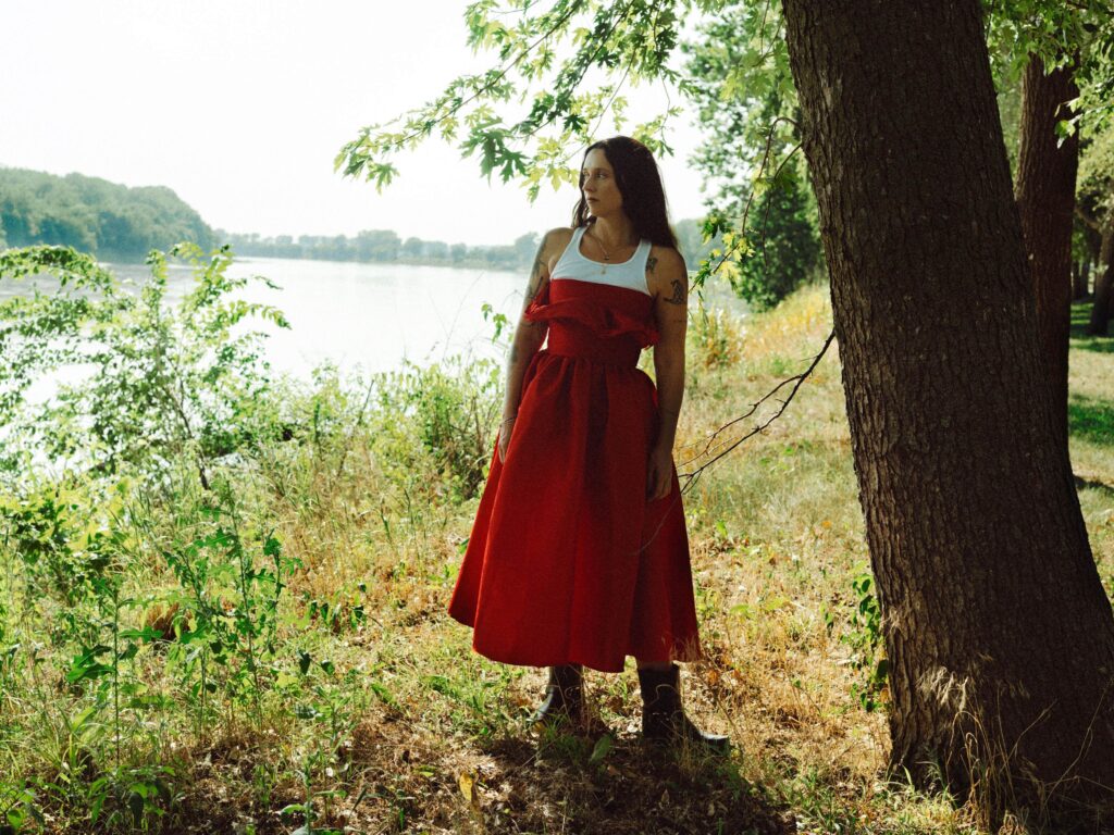 Waxahatchee Waxahatchee by a tree