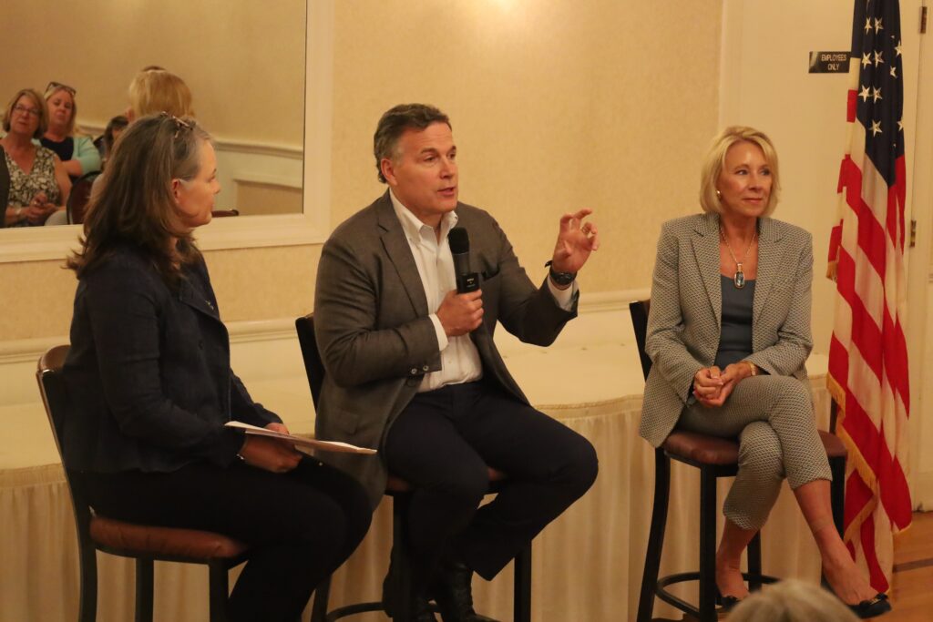 ali-warner-David-McCormick-Betsy-DeVos (1) Republican Senate candidate David McCormick discusses education and “woke ideology” with Aly Warner (left), chair of the Northampton County chapter of Moms for Liberty, and Betsy DeVos (right), secretary of education under the Trump Administration. (Carmen Russell-Sluchansky)