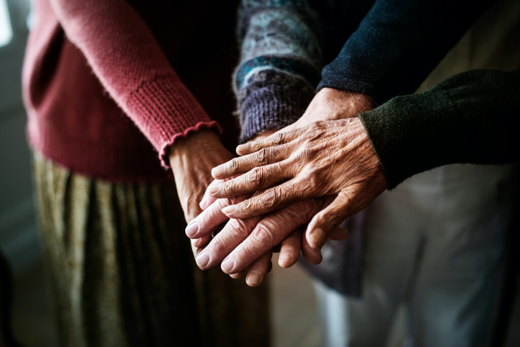 Closeup of hands of group of seniors Closeup of hands of group of seniors