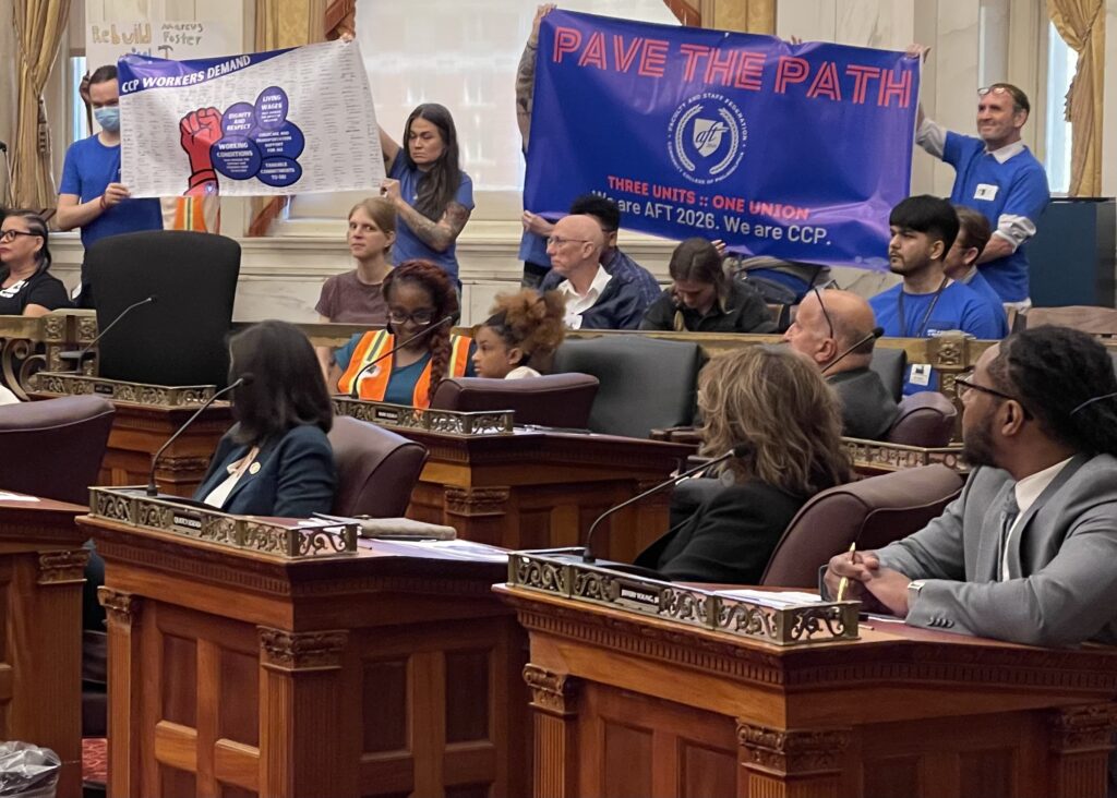 ccp-council-m-rinde-2024-05-04 people holding up a banner during city council hearing