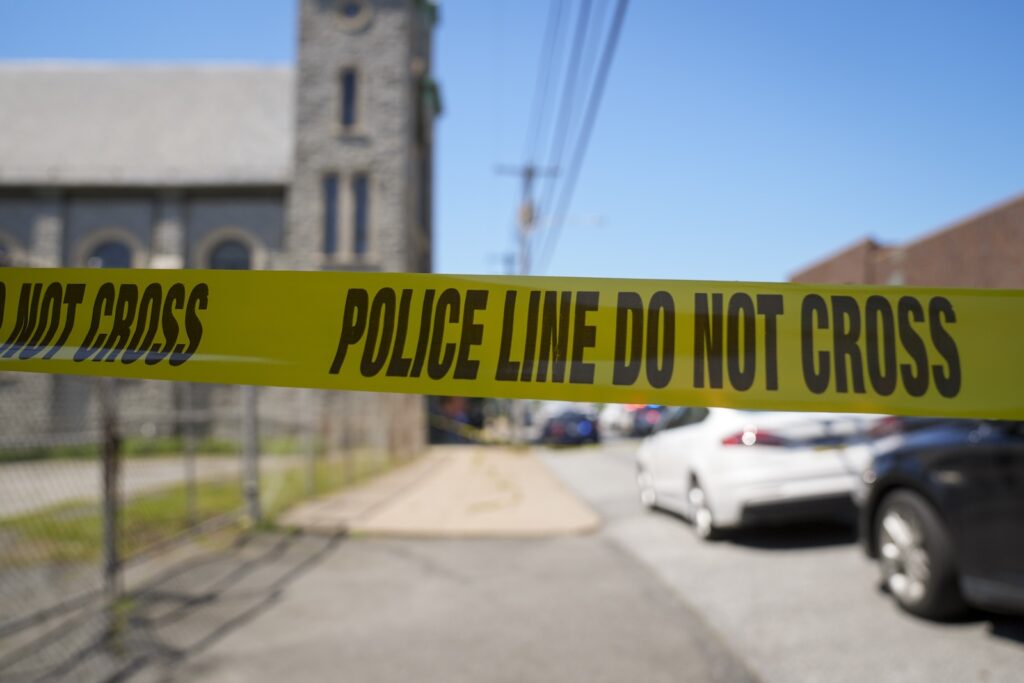 Police tape cordons off the scene of a fatal shooting at Delaware County Linen in Chester, Pa., Wednesday, May 22, 2024.