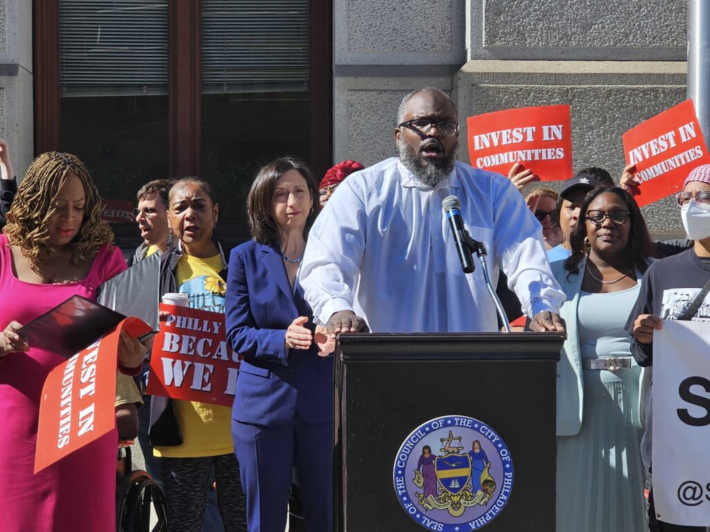 Shawmar Pitts speaking at a podium