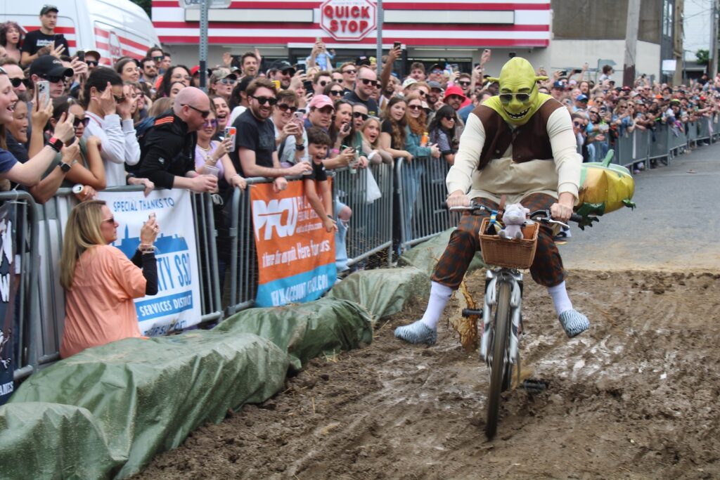 derby-17 Shrek, from “The Swamp” team, rides through the mud pit at the 2024 Kensington Derby.
