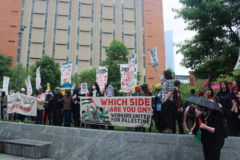 gaza-protest-9 Hundreds of pro-Palestinian protesters marched from City Hall toward University City on Saturday. They linked arms and encircled a group of people setting up tents on Drexel University's campus. (Emily Neil/WHYY News)