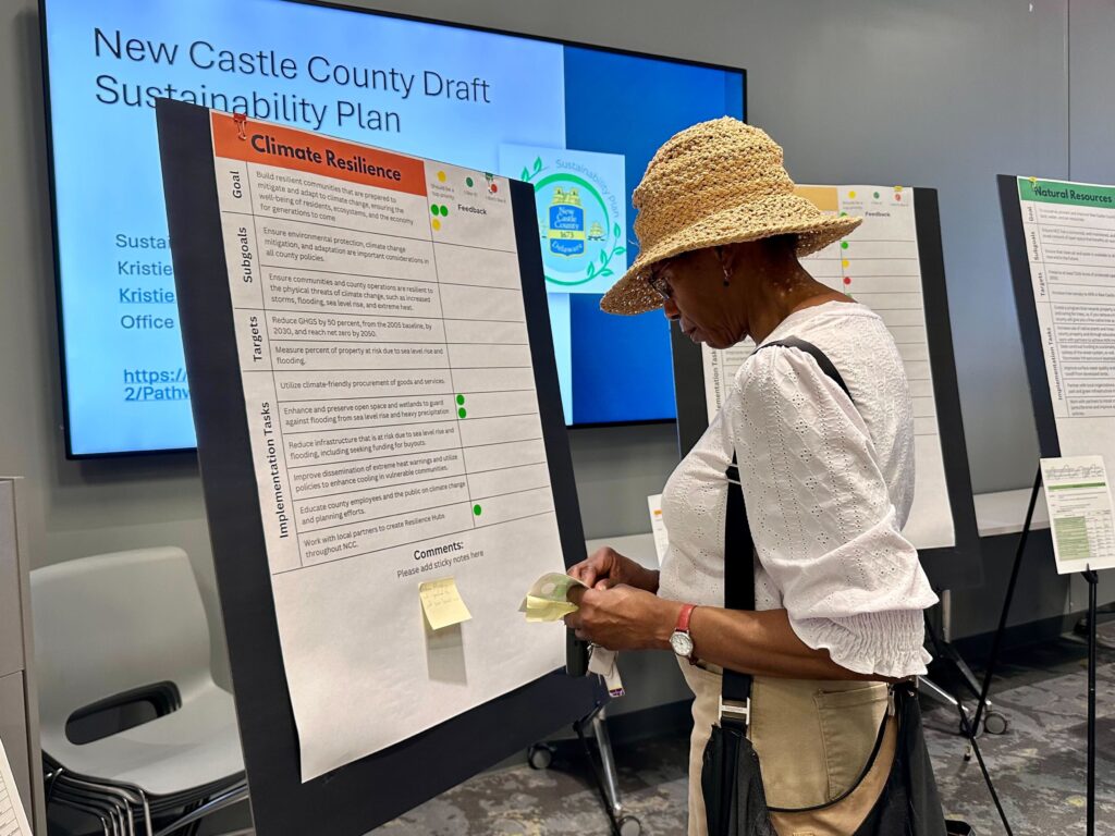 Jeanette Swain reading information on a bulletin board.