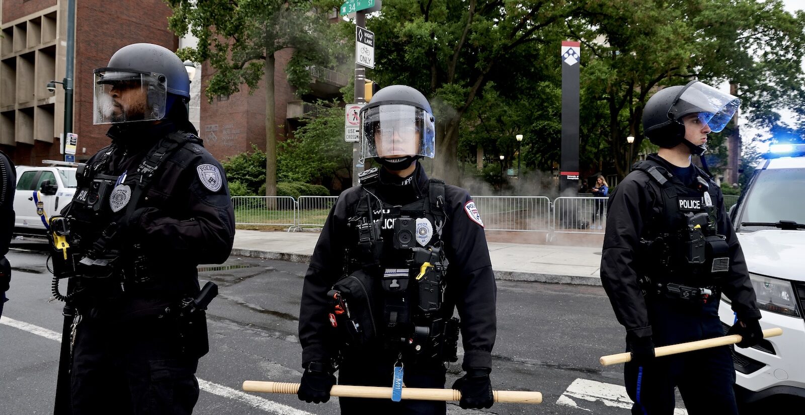 Police in riot gear block access to Penn's campus green where crews were clearing the protest encampment.