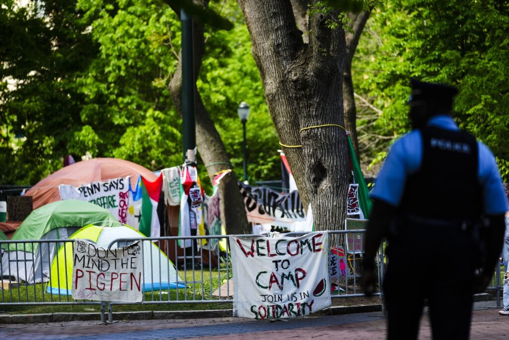 An officer stands outside a Gaza Solidarity Encampment at the University of Pennsylvania in Philadelphia, Wednesday, May 1, 2024.