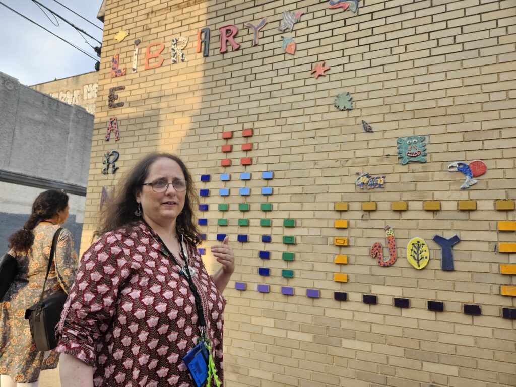 Sara Palmer stands outside Kensington Library