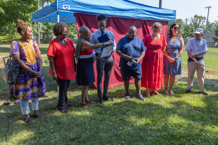 People standing in a row at the unveiling