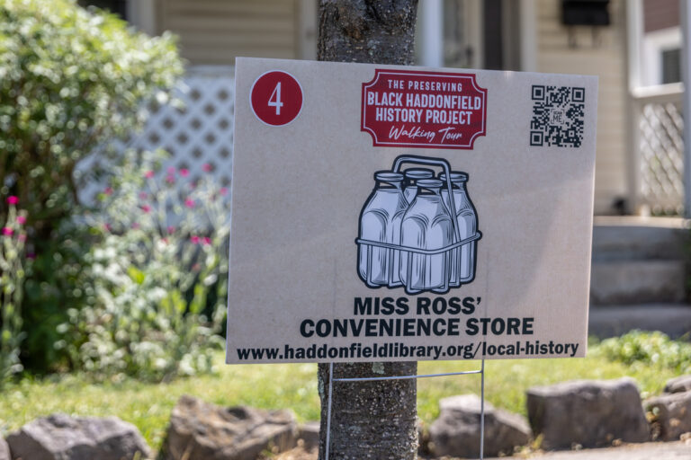 A sign says 'Miss Ross' Convenience Store'